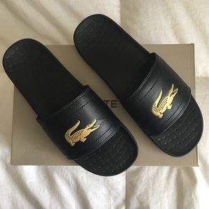 black and gold lacoste slides